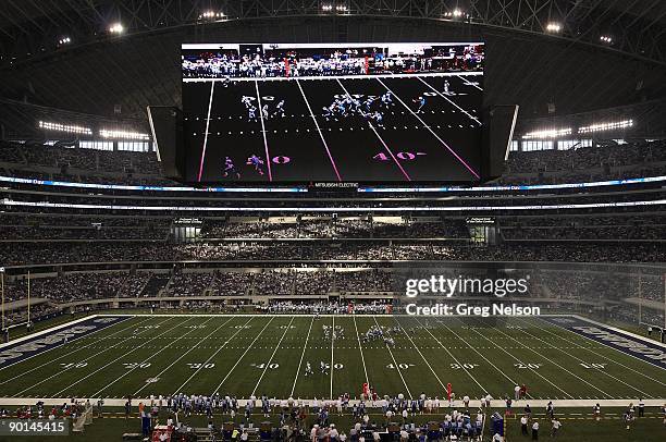 View of Cowboys Stadium HD scoreboard during Dallas Cowboys vs Tennessee Titans preseason game. Tennessee Titans A.J. Trapasso hit HD screen which is...