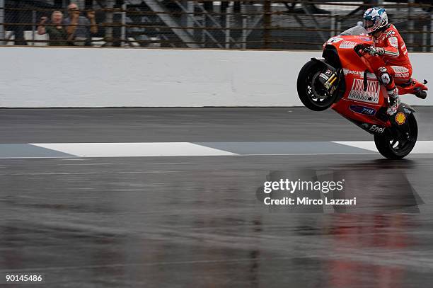 Nicky Hayden of the U.S. And Ducati Malboro Team lifts the front wheel during the free practice of the Red Bull Indianapolis Grand Prix in...