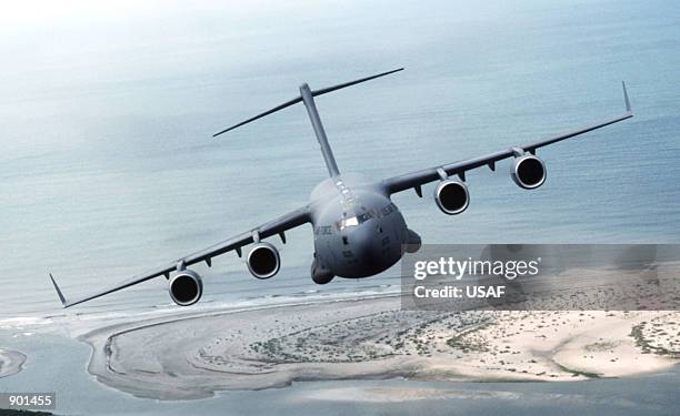 An air-to-air front view of a C-17 Globemaster III from the 17th Airlift Squadron, 437th Air Wing, Charleston Air Force Base, South Carolina as it...