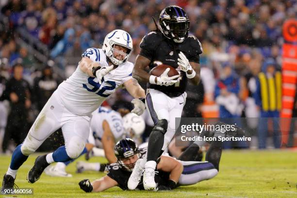 Baltimore Ravens running back Alex Collins heads up field during the game between the Indianapolis Colts and Baltimore Ravens on December 23 at M&T...