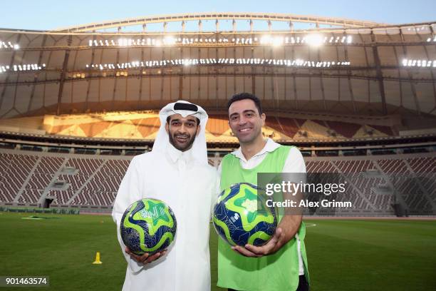 Hassan Al Thawadi, the Secretary General of the Qatar's Supreme Committee for Delivery and Legacy poses with former Spanish football professional and...