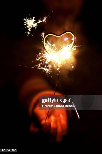 little heart-shaped fireworks - border collie christmas stock pictures, royalty-free photos & images