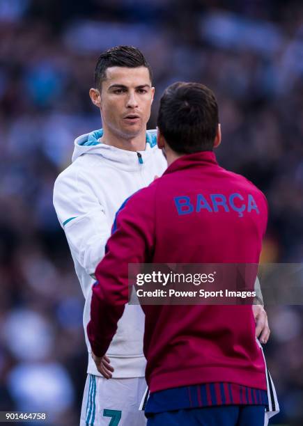 Cristiano Ronaldo of Real Madrid and Lionel Andres Messi of FC Barcelona shake hands prior to the La Liga 2017-18 match between Real Madrid and FC...