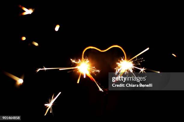 little heart-shaped fireworks - border collie christmas stock pictures, royalty-free photos & images