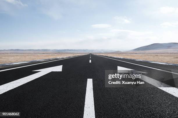 prairie landscape and rural highway in winter. - sharp angle stock pictures, royalty-free photos & images