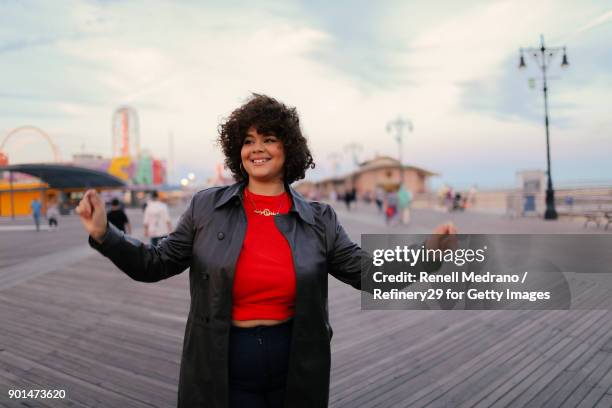 young confident woman outside - coney island stock-fotos und bilder