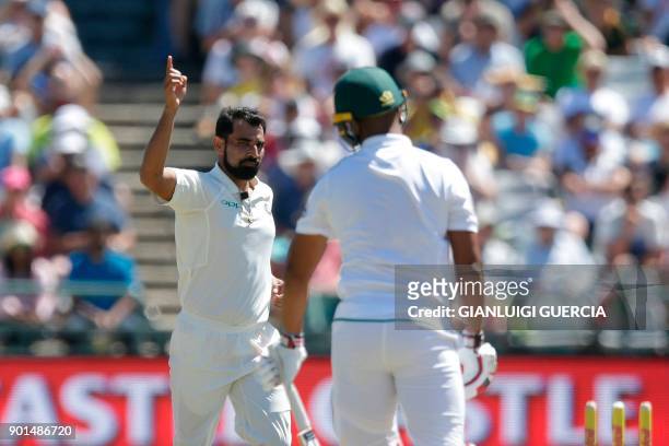 Indian bowler Mohammed Shami celebrates the dismissal of South African batsman Vernon Philander during Day One of the cricket First Test match...