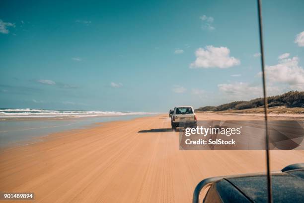 driving on the 75 mile beach - four wheel drive stock pictures, royalty-free photos & images