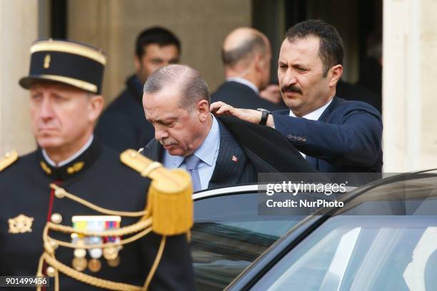 Turkish President Recep Tayyip Erdogan gets out of his car at the Elysee palace in Paris for a meeting with his French counterpart on January 5, 2018...