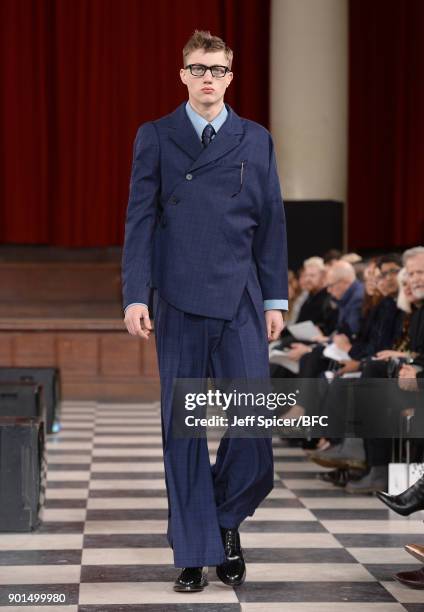 Model walks the runway wearing a design by Sohyeon Park at the LCFMA18 Menswear show during London Fashion Week Men's January 2018 at St John's,...