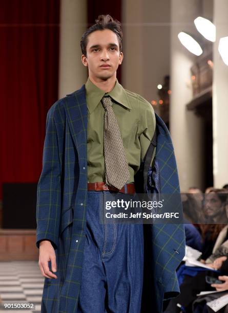 Model walks the runway wearing a design by Sohyeon Park at the LCFMA18 Menswear show during London Fashion Week Men's January 2018 at St John's,...