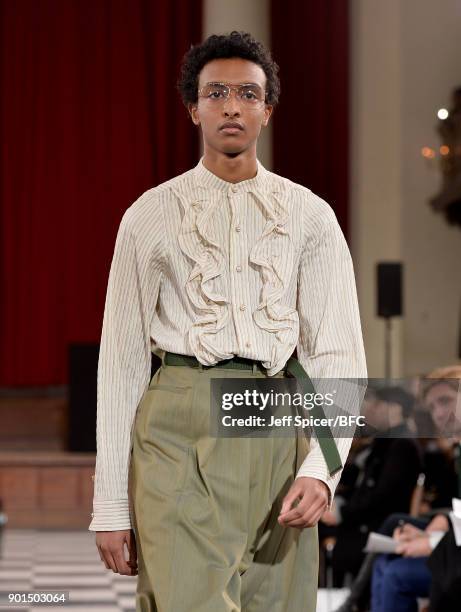 Model walks the runway wearing a design by Sohyeon Park at the LCFMA18 Menswear show during London Fashion Week Men's January 2018 at St John's,...