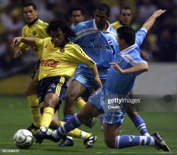 Julio Cesar Valdivieso of Bolivia's soccer club Bolivar stops Fabian Stay of Mexico's America team during a soccer tournament game in Mexico City 17...