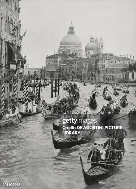 Parade of gondolas and other boats escort, along the Grand Canal, Prince of Udine Ferdinando di Savoia-Genova on the day of the Royal Regatta,...