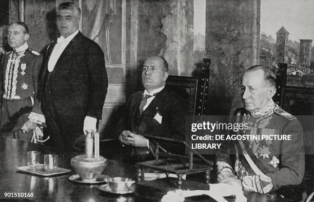 Benito Mussolini , left, leader of the National Fascist Party, and inventor Guglielmo Marconi , right, on the day of Marconi's installation as...