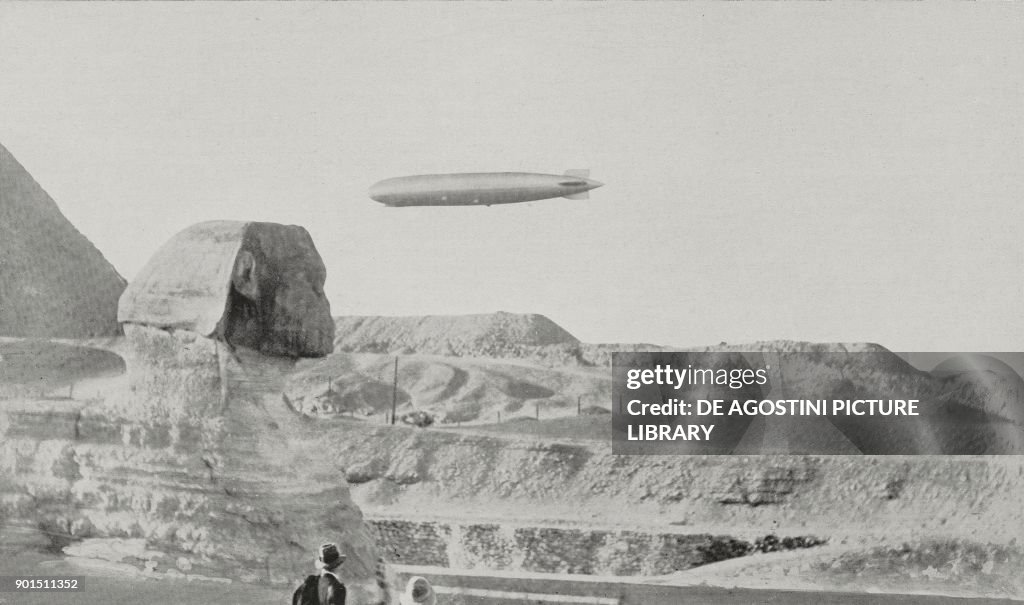 Zeppelin flies over Sphinx and Giza pyramids