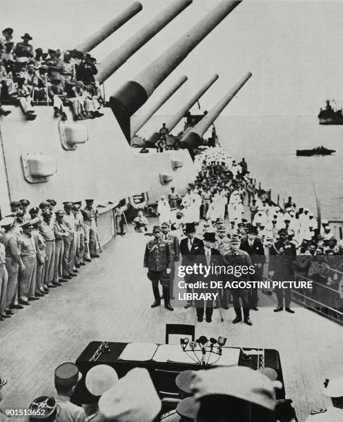 Japanese delegation, led by Minister Mamoru Shigemitsu, approaching the table to sign the surrender aboard the US battleship USS Missouri, September...