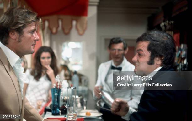 Actors Roger Moore and Tony Curtis in a scene from the television series, 'The Persuaders', 1972.