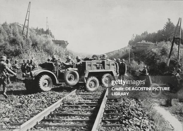 German anti-tank gun crossing the tracks at Maastricht, Netherlands, World War II, from L'Illustrazione Italiana, Year LXVII, No 21, May 26, 1940.