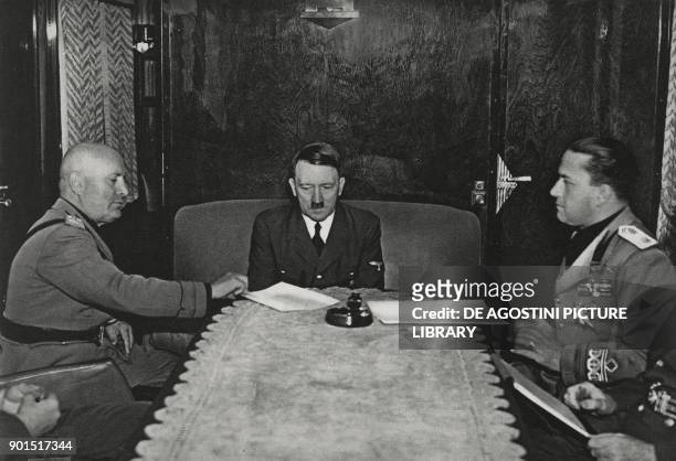 Benito Mussolini, Adolf Hitler and Galeazzo Ciano in Hitler 's railway carriage during the meeting at the Brenner Pass, March 18 Austria, Italy,...