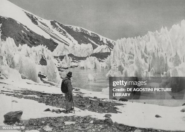 Mountaineer contemplates the fabulous ice scenery of Everest, Himalayas, on the border between China and Nepal, photo from L'illustrazione Italiana,...