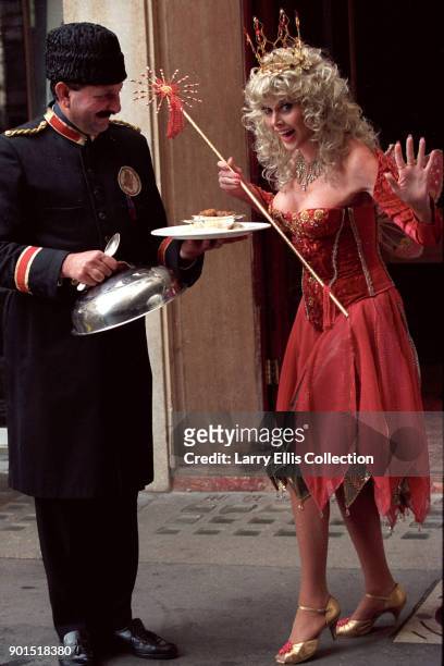 Swedish actress Britt Ekland gets ready for panto season outside Victory House on London's Regent Street, 1995.