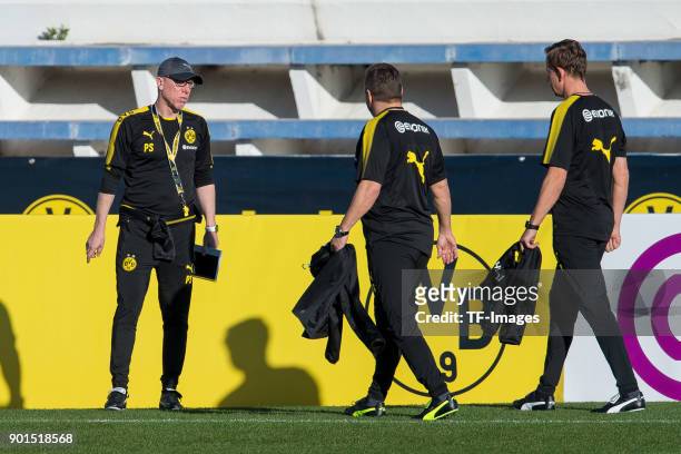 Head coach Peter Stoeger of Dortmund, Assistant coach Manfred Schmid of Dortmund and Assistant coach Joerg Heinrich of Dortmund look on during the...