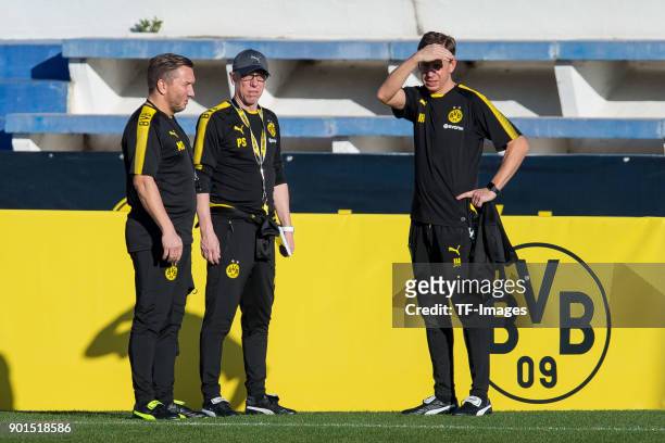 Assistant coach Manfred Schmid of Dortmund, Head coach Peter Stoeger of Dortmund and Assistant coach Joerg Heinrich of Dortmund look on during the...