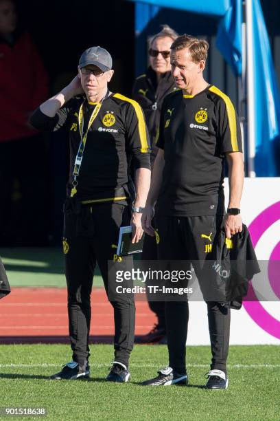 Head coach Peter Stoeger of Dortmund and Assistant coach Joerg Heinrich of Dortmund look on during the Borussia Dortmund training camp at Marbella...