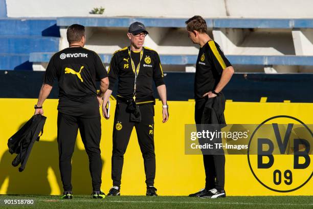 Head coach Peter Stoeger of Dortmund speaks with Assistant coach Joerg Heinrich of Dortmund during the Borussia Dortmund training camp at Marbella...