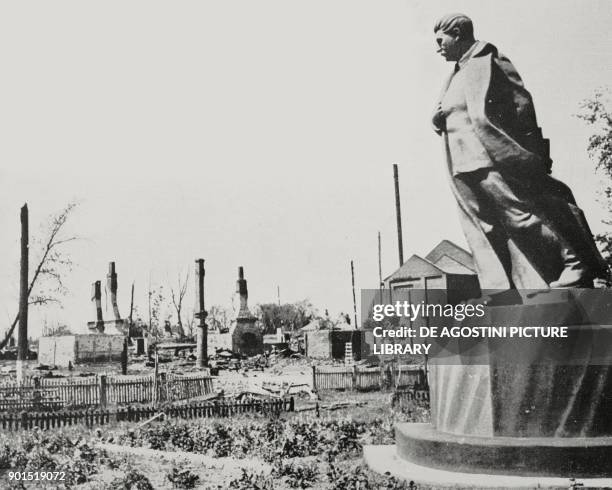 Statue of Joseph Stalin still standing in the ruins of a Soviet city, World War II, from L'Illustrazione Italiana, Year LXVIII, No 32, August 10,...
