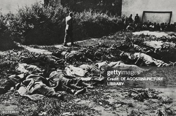 Prisoners killed by the Soviets before the arrival of German troops and piled in the courtyard of Lviv prison, Ukraine, World War II, from...