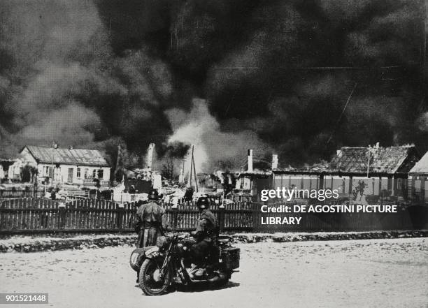 Russian village burned down by Soviet commissars under pressure from the German advance, Russia, World War II, from L'Illustrazione Italiana, Year...