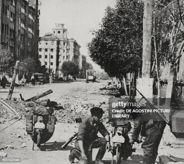 Soldiers from German motorised units along the streets of Voronezh, Russia, World War II, from L'Illustrazione Italiana, Year LXIX, No 32, August 9,...