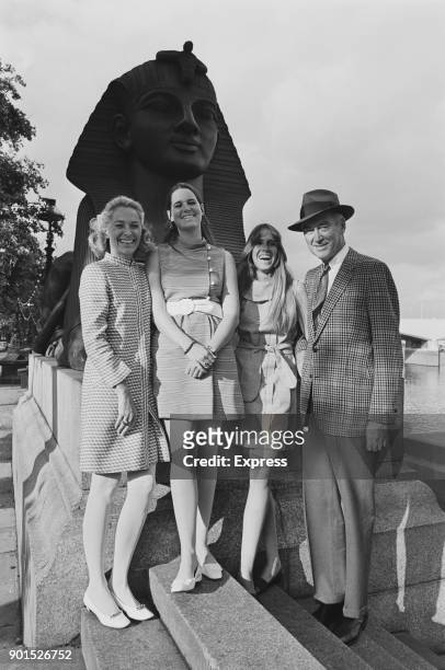 American actor James Stewart with his wife, actress and model Gloria Hatrick McLean and their daughters Judy and Kelly, sightseeing in London, UK,...