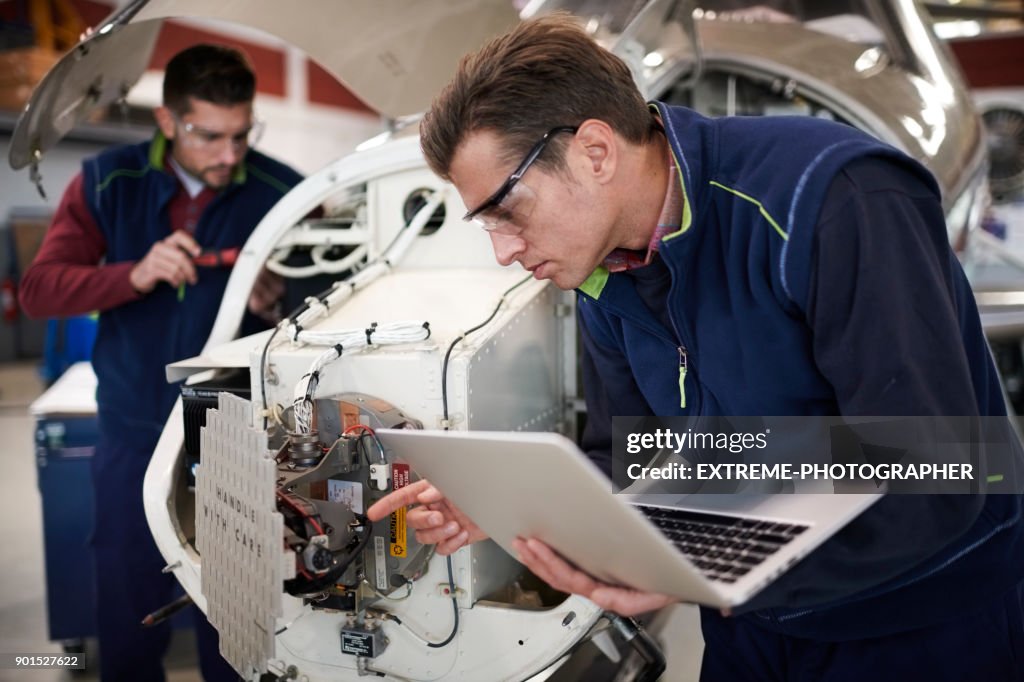 Aircraft mechanics in the hangar