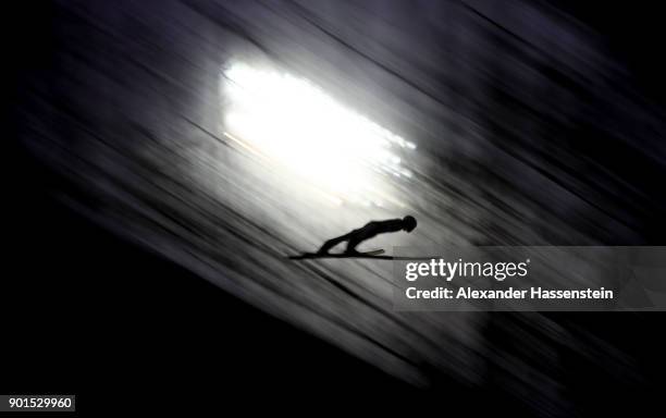 Andreas Wellinger of Germnay soars through the air during his practice jump of the FIS Nordic World Cup Four Hills Tournament on January 5, 2018 in...