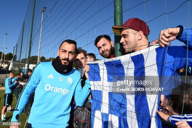 Olympique de Marseille's Greek forward Konstantinos Mitroglou poses for supporters during a training session on January 5, 2018 at the Robert-Louis...