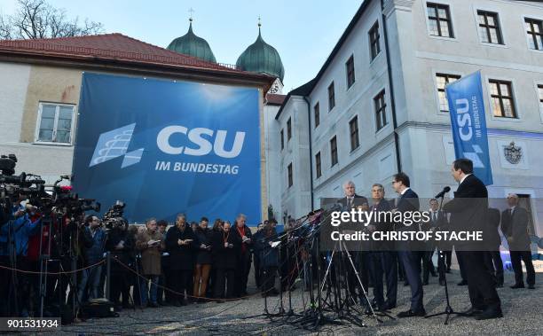 Hungarian Prime Minister Viktor Orban is flanked by the leader of the Christian Social Union Horst Seehofer and German Transport Minister Alexander...