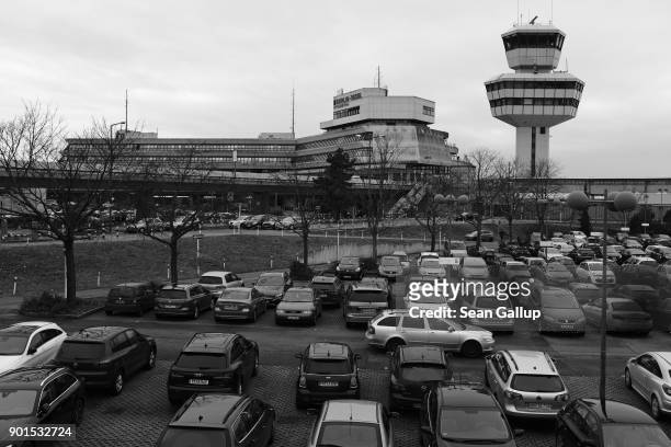 Cars stand parked at Tegel Airport on January 5, 2018 in Berlin, Germany. The future of Tegel is unclear. While many Berliners have signed a petition...