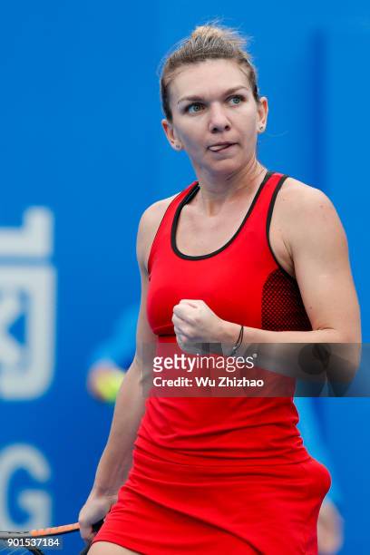 Simona Halep of Romania celebrates after winning her semi-final match against Irina-Camelia Begu of Romania on Day 6 of 2018 WTA Shenzhen Open at...