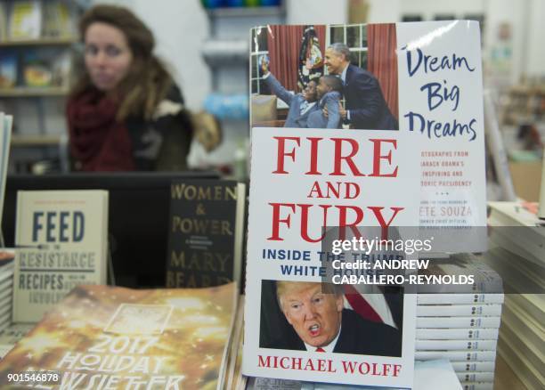 Copy of the book "Fire and Fury: Inside the Trump White House" by Michael Wolff sits on display at a bookstore in Washington, DC on January 5, 2018....