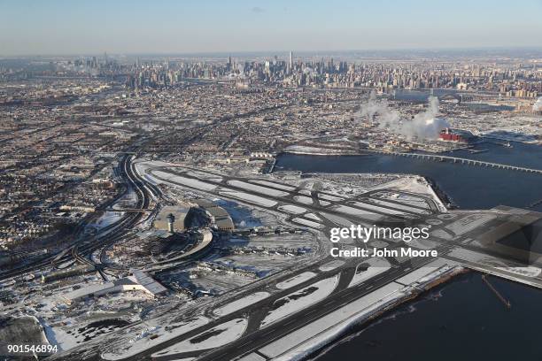 La Guardia Airport awaits arriving flights after runways were plowed of snow on January 5, 2018 in the Queens borough of New York City. Under frigid...