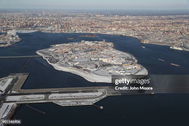 Rikers Island jail complex stands under a blanket of snow next to La Guardia Airport on January 5, 2018 in the Bronx borough of New York City. Under...