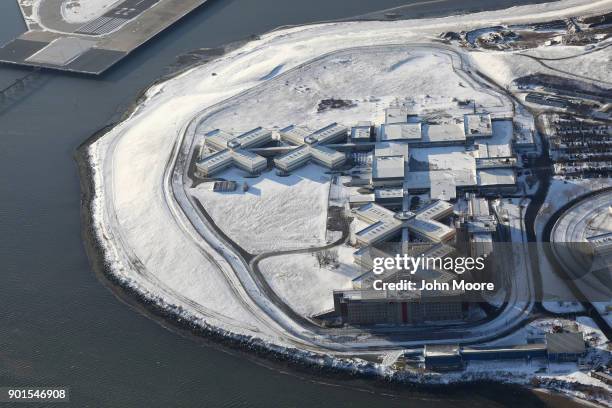 Rikers Island jail complex stands under a blanket of snow on January 5, 2018 in the Bronx borough of New York City. Under frigid temperatures, New...