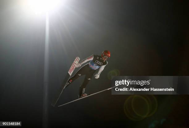 Karl Geiger of Germany soars through the air during his qualification jump of the FIS Nordic World Cup Four Hills Tournament on January 5, 2018 in...