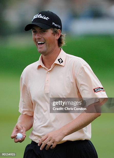 Webb Simpson laughs as he walks off the 7th green during the second round of The Barclays at Liberty National Golf Club on August 28, 2009 in Jersey...