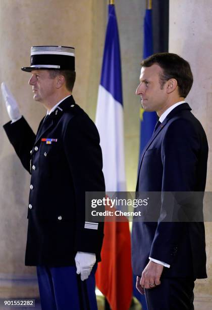 French President, Emmanuel Macron waits as Turkish President Recep Tayyip Erdogan leaves the Elysee Presidential Palace after their meeting on...