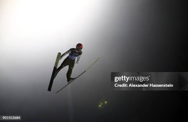 Markus Eisenbichler of Germany soars through the air during his qualification jump of the FIS Nordic World Cup Four Hills Tournament on January 5,...