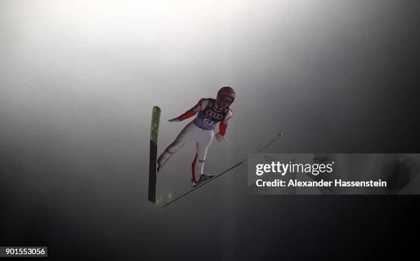 Stefan Kraft of Austria soars through the air during his qualification jump of the FIS Nordic World Cup Four Hills Tournament on January 5, 2018 in...